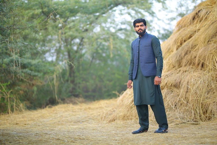 Man Next To Hay Stack