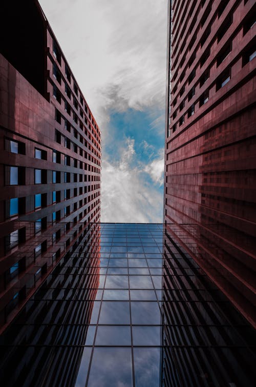 A Low Angle Shot of a Building with Glass Windows