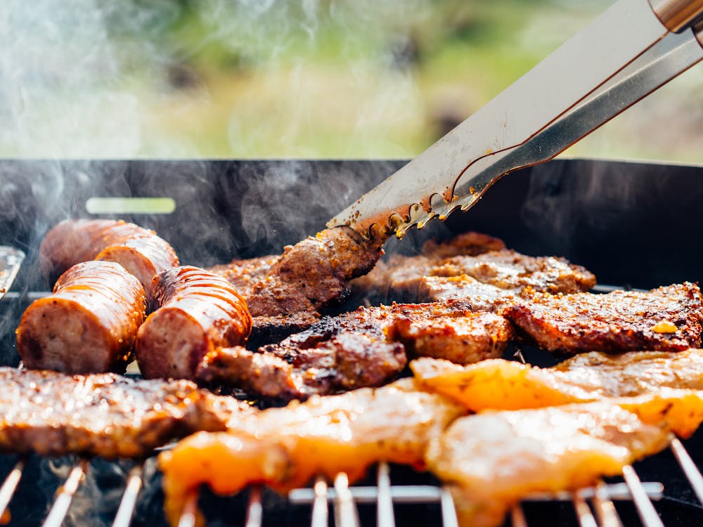 Free Person Grilling Meats Stock Photo
