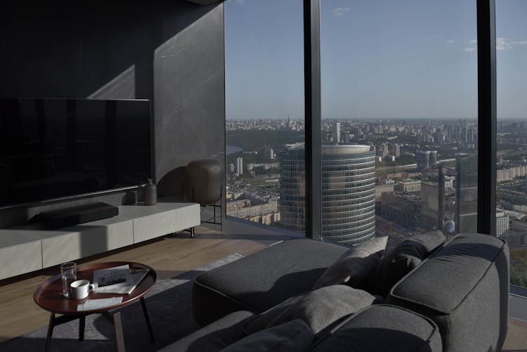 Black And Gray Sectional Couch Beside Glass Windows