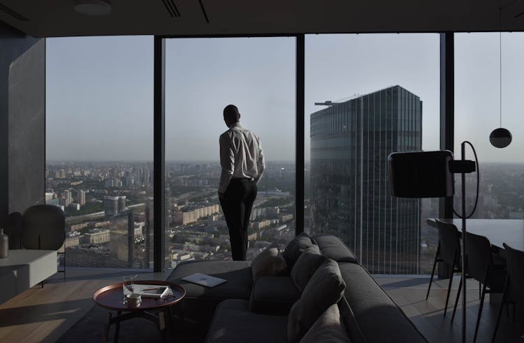 Man In Shirt In Luxury Apartment In City