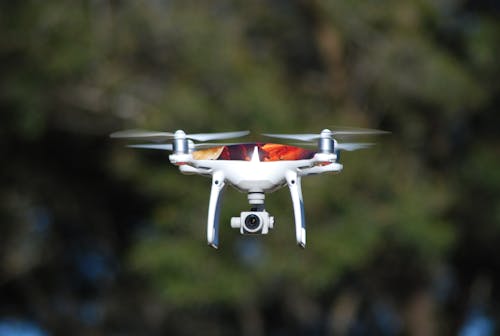Free Photo of a White Drone Flying Stock Photo