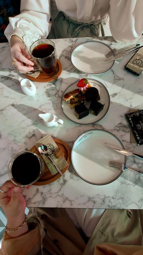 Free Top view of a stylish dessert and coffee meeting with elegant table setting. Stock Photo