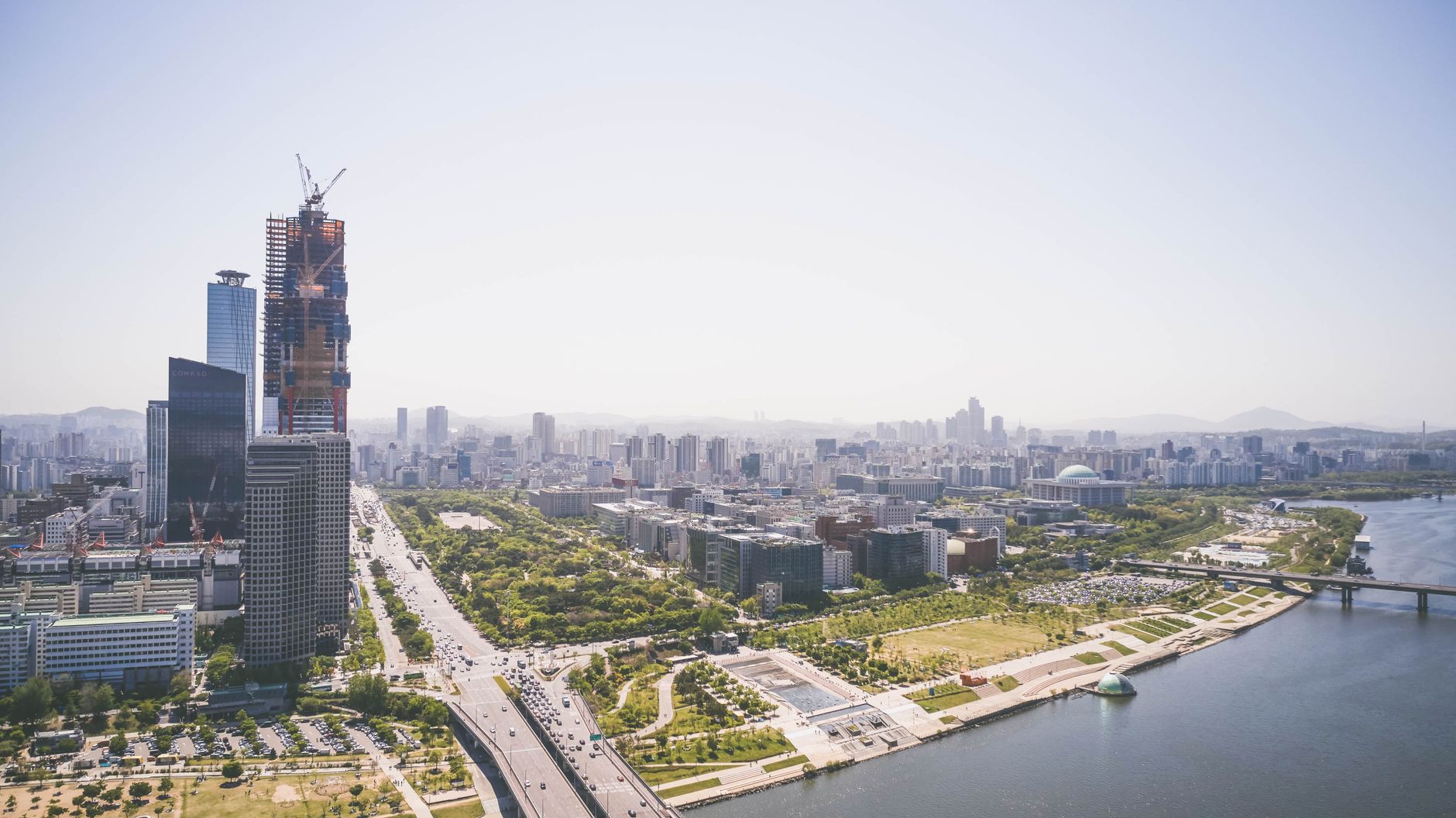 A breathtaking aerial view of Seoul cityscape with skyscrapers and Han River.