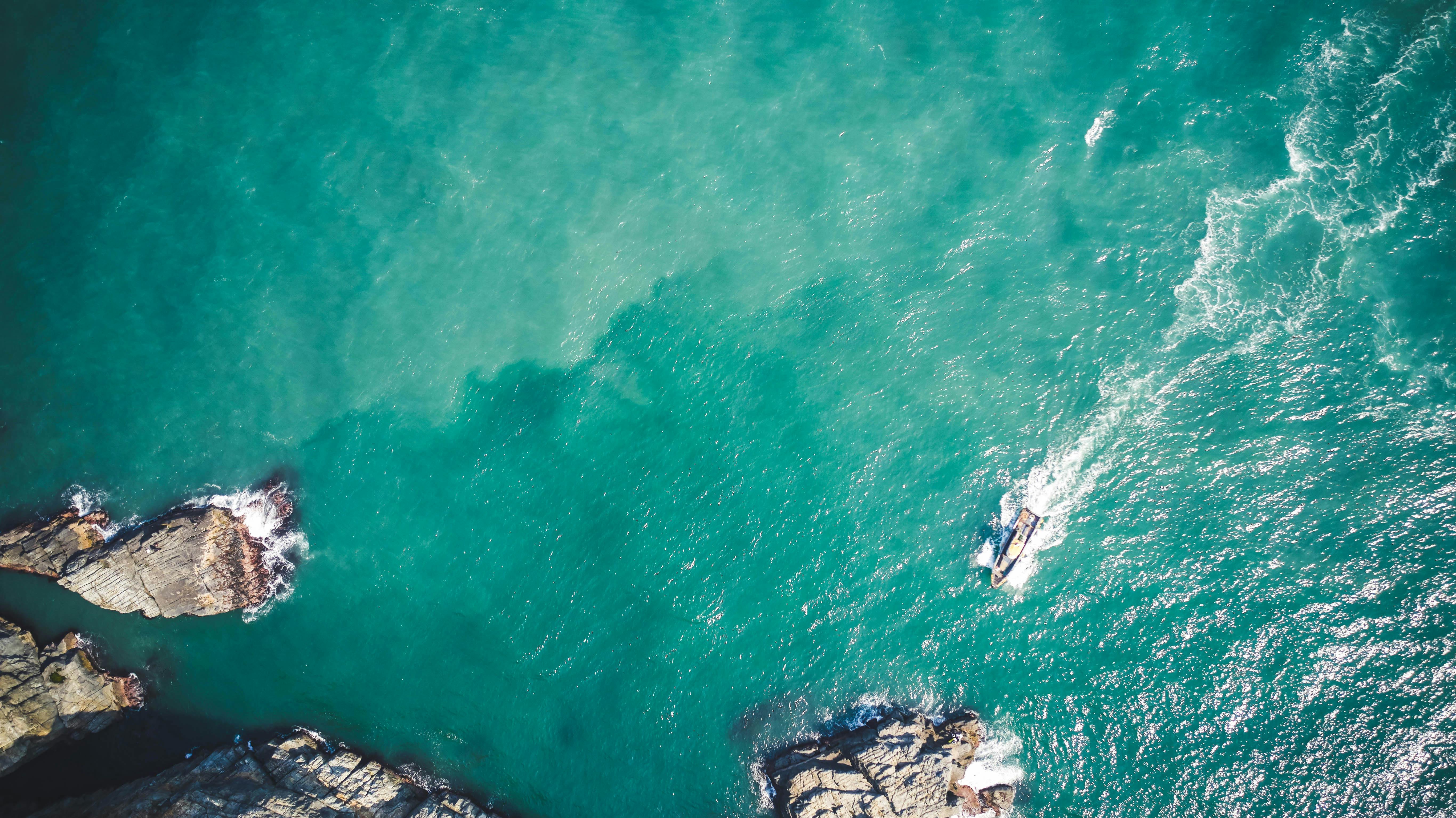 A Top View of an Ocean with Rock Formations · Free Stock Photo