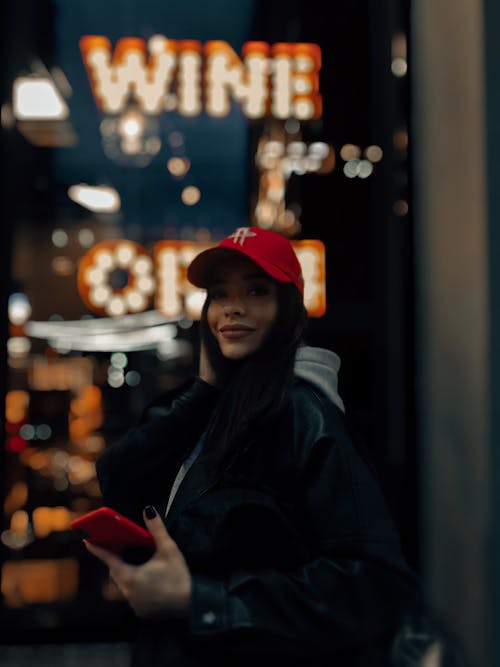 Free Woman in Black Jacket and Red Cap Stock Photo