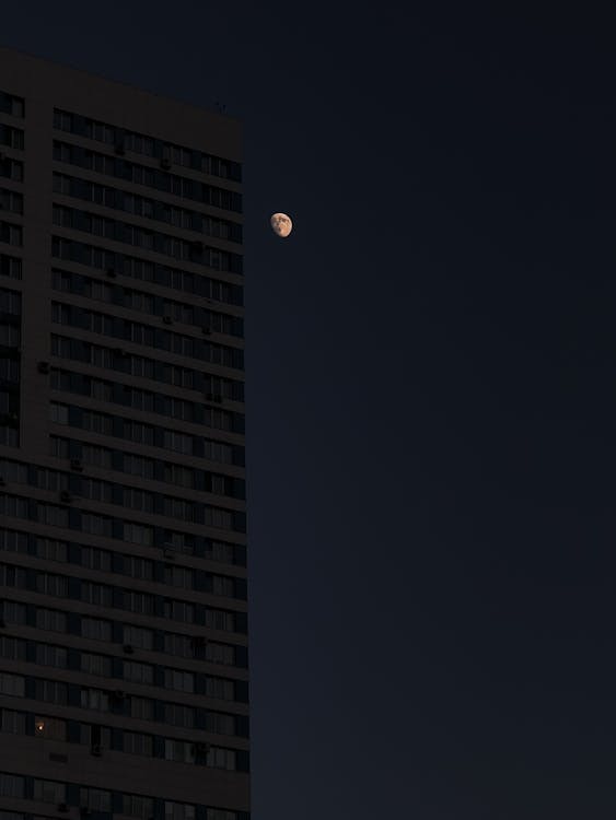 Moon over High Rise Building · Free Stock Photo