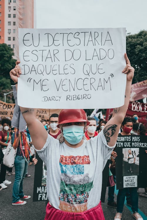 Female Proetster holding a Placard 