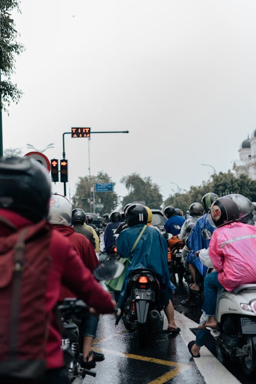 Free People Riding Motorcycle on the Street Stock Photo