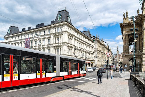 Red and White Tram on the Street