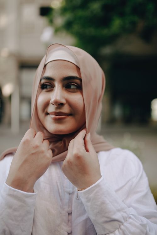 Close-Up Shot of a Woman in Brown Hijab Smiling · Free Stock Photo