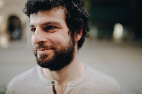 Close-Up Shot of a Handsome Bearded Man Smiling