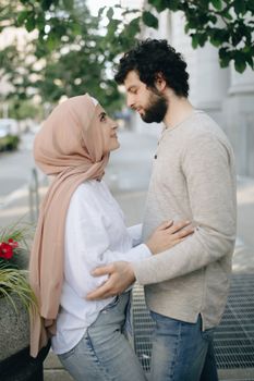 A romantic couple sharing an affectionate moment outdoors, capturing the essence of love.