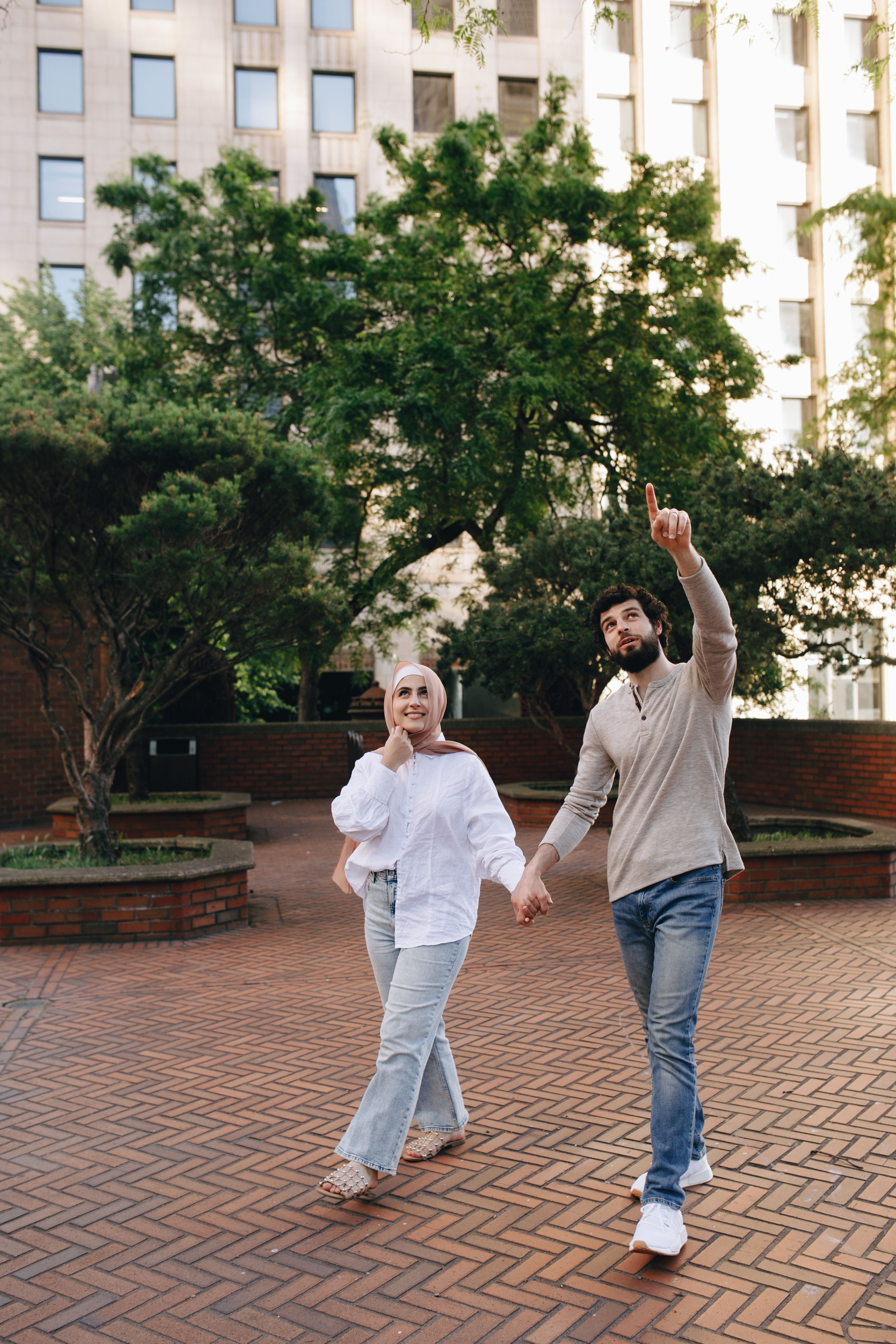 A Couple Holding Hands while Walking · Free Stock Photo