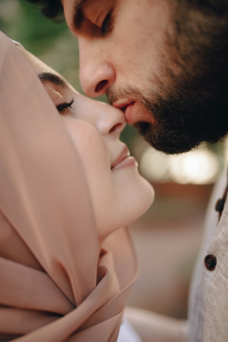 Man Kissing Woman's Nose