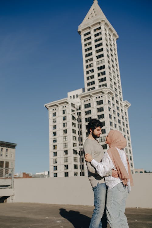 Couple Hugging Each Other on Building Roof Top