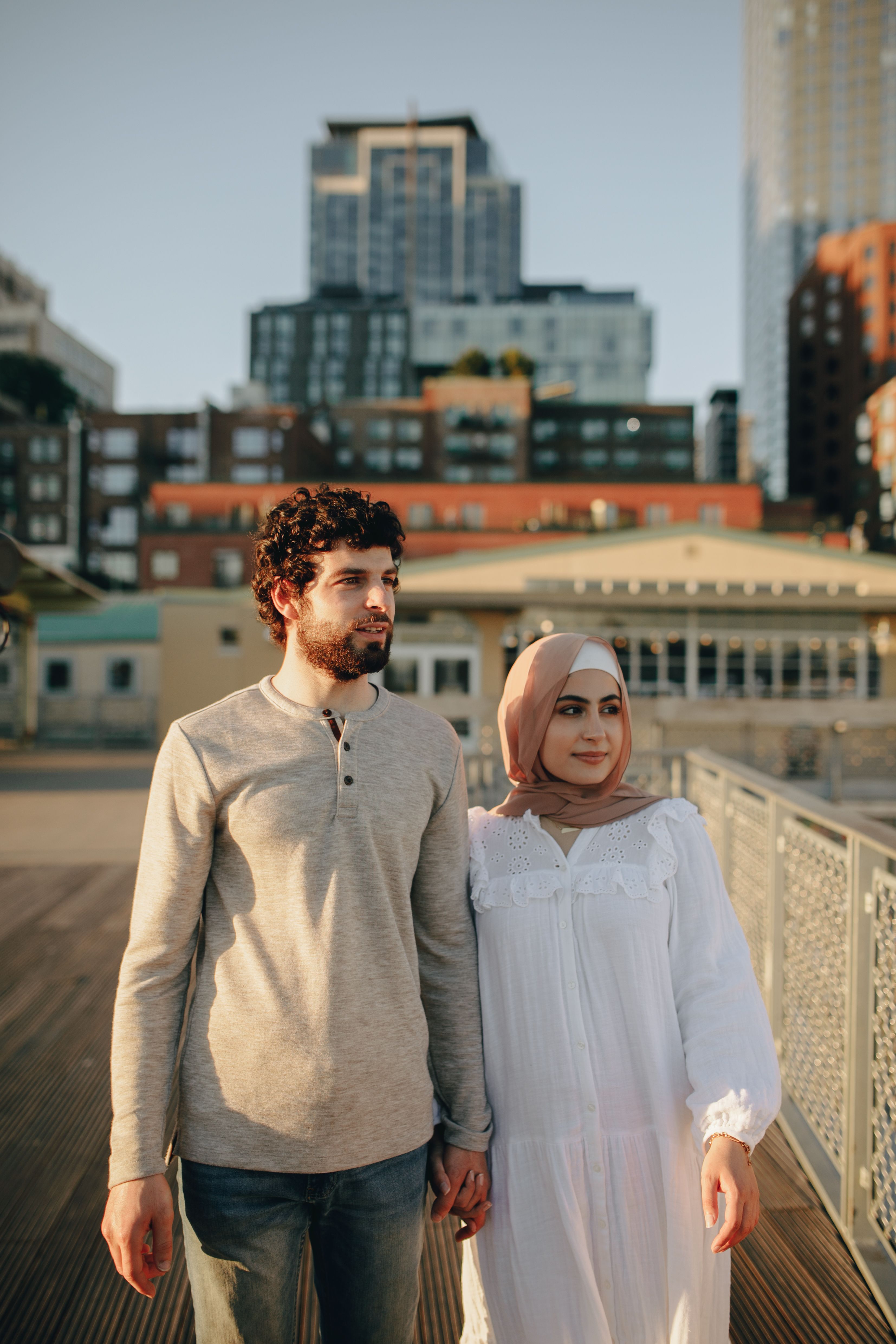 A Man and Woman Walking while Holding Hands · Free Stock Photo