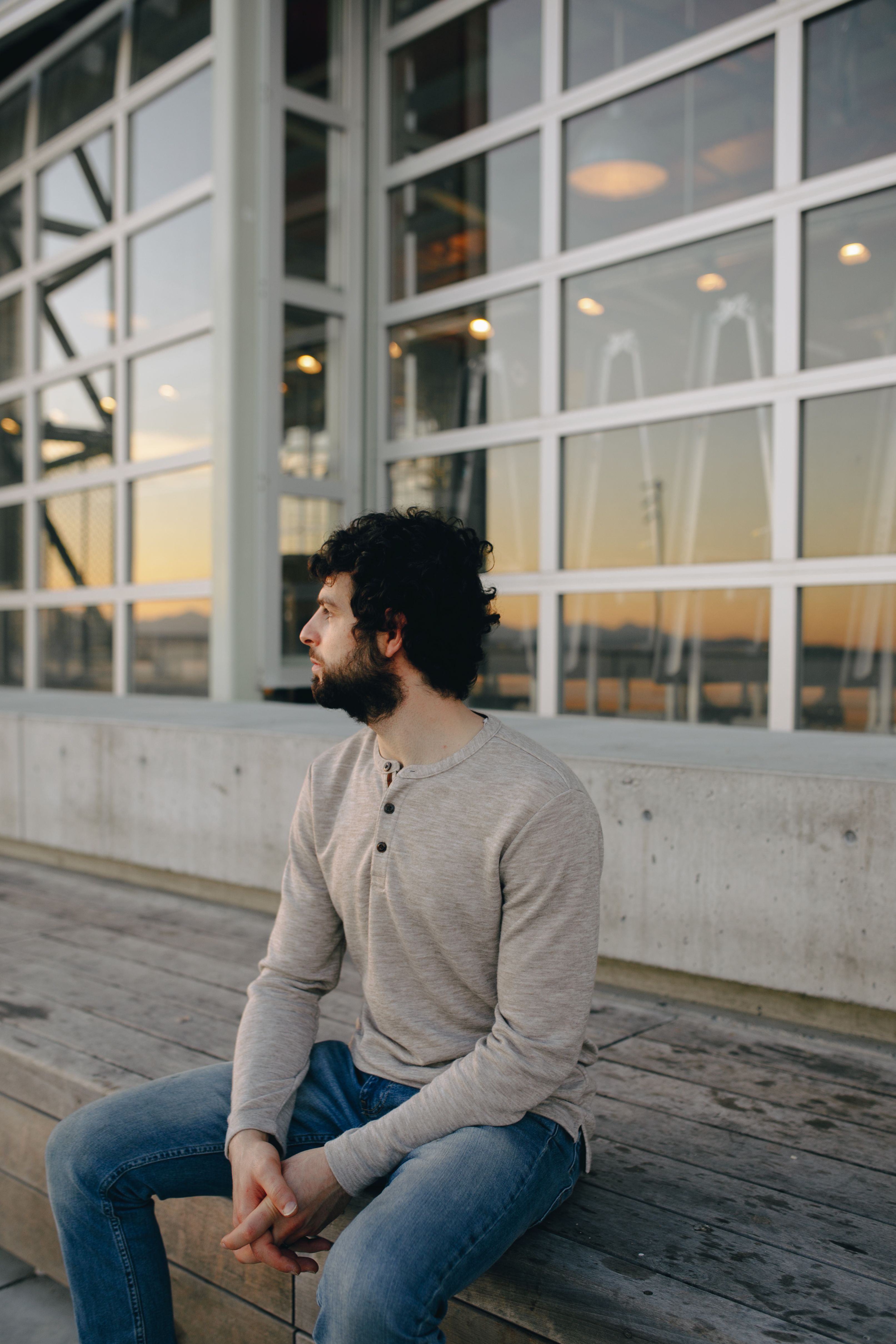A Bearded Man in Gray Sweater and Denim 