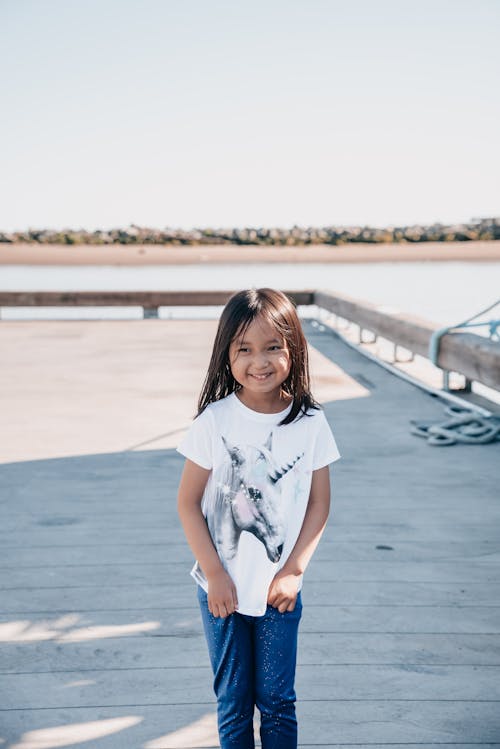 Cute Girl in White Shirt Smiling