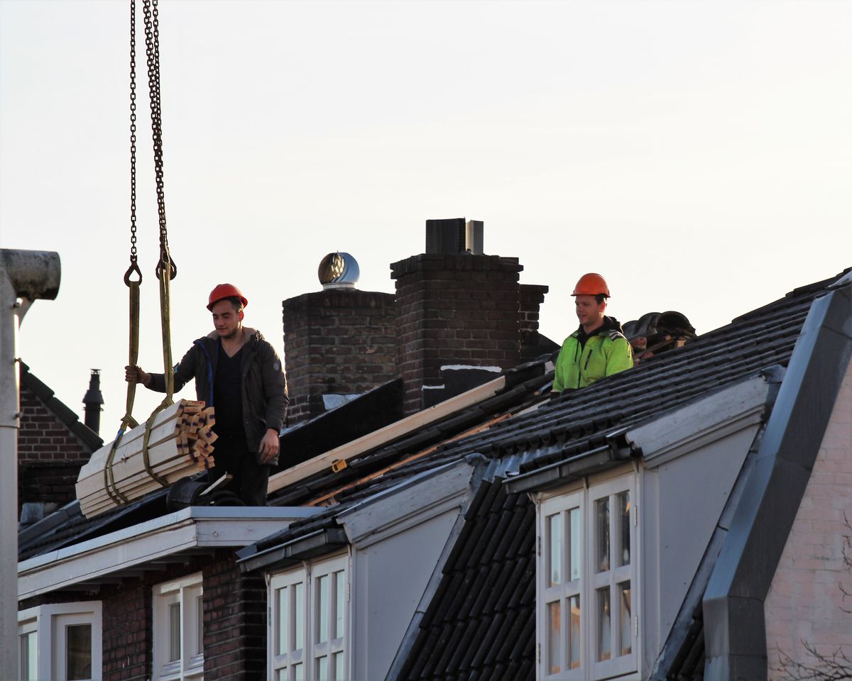 Protective team working on asbestos roof removal