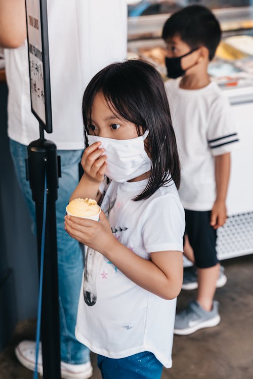 Girl in White Shirt Wearing White Face Mask