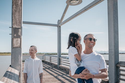 Happy Family Standing at a Boardwalk