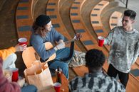 Man in Black Knit Cap Playing Guitar
