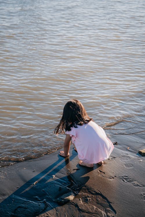 Girl Playing at the Beach