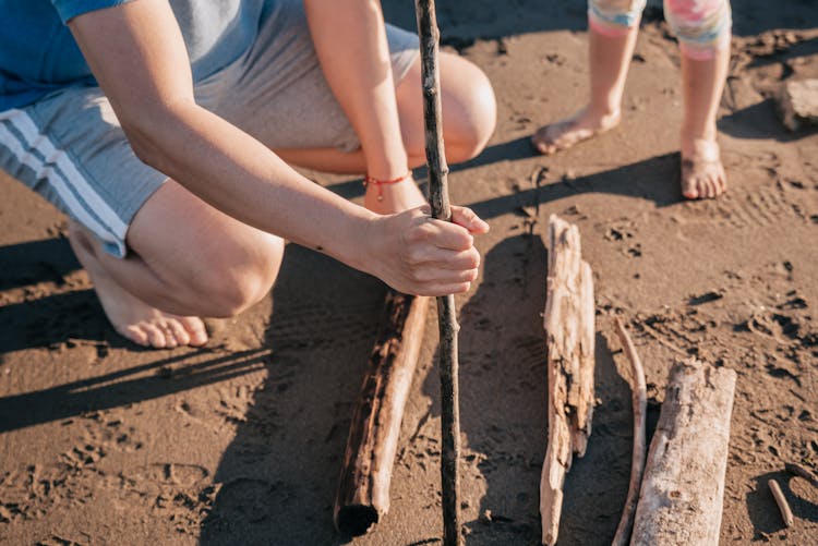 Close-Up Photo Of A Person Holding A Stick