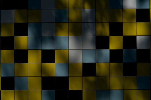 Vibrant tiled wall showcasing bold colors and shadow play, creating an abstract pattern.