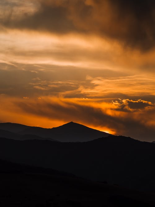Free Silhouette of Mountain during Sunset Stock Photo