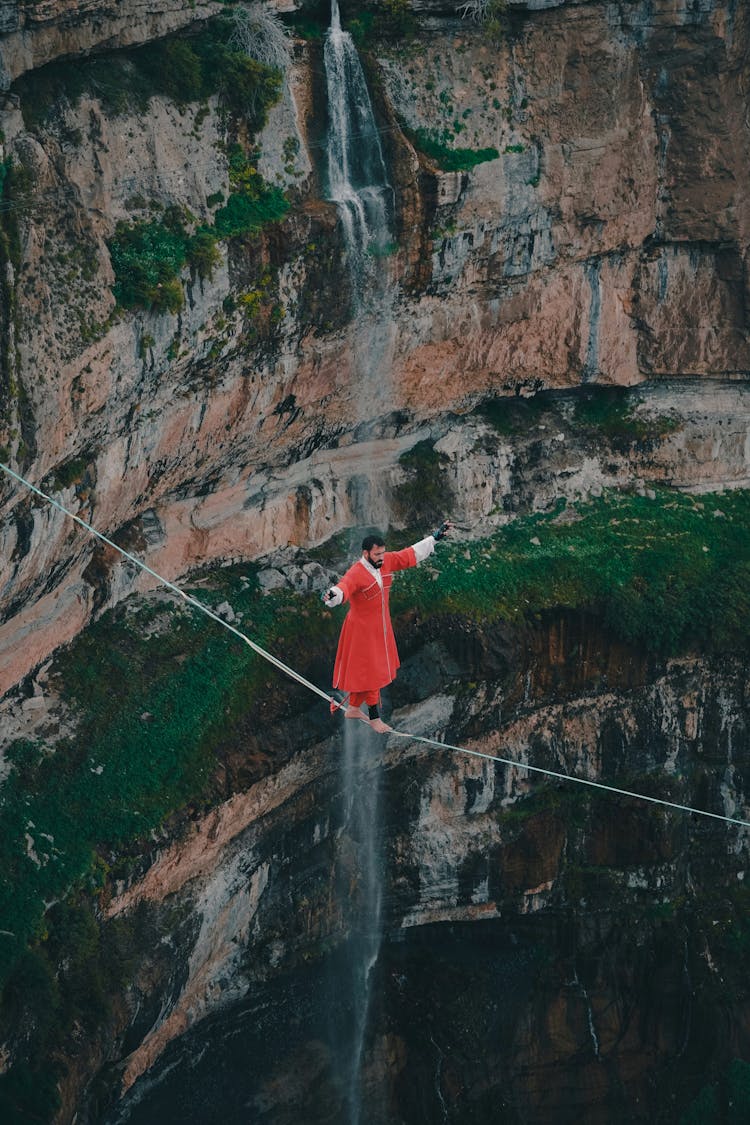 Drone Shot Of A Man Walking On Rope 