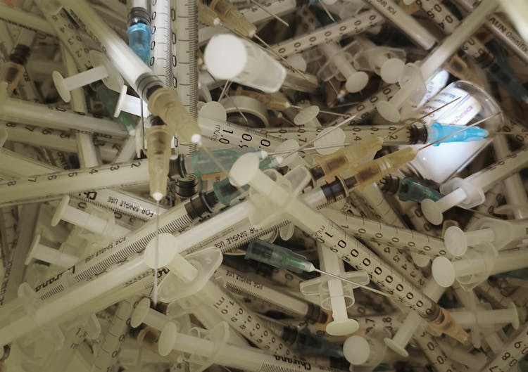 Close-up Photo Of Used Syringes