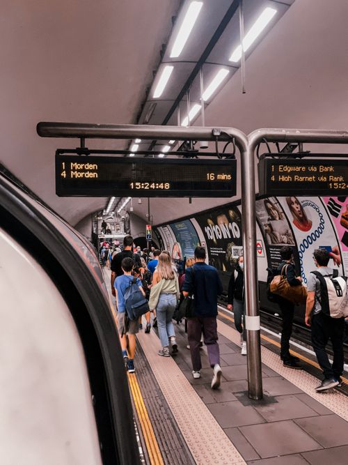 Free Commuters walking on a busy platform at a London Underground station. Stock Photo