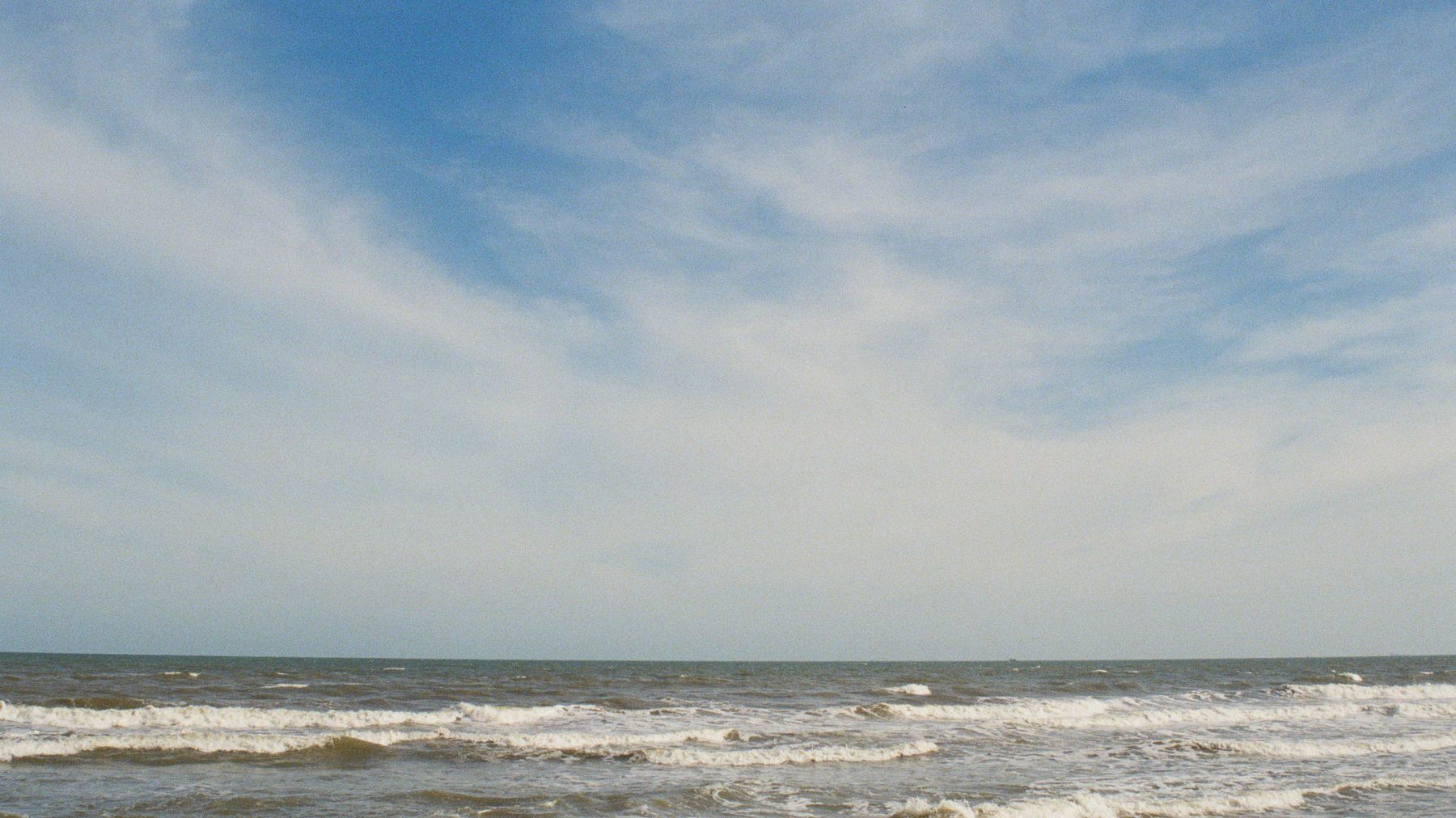 Tranquil seascape at Lang Phuoc Hai beach in Vietnam with beautiful sky and gentle waves.