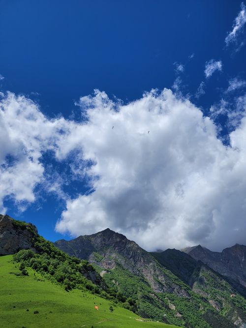Free Majestic mountains under fluffy clouds in Kabardino-Balkarian Republic, Russia. Stock Photo