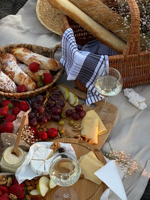 Free Lavish picnic setting with wine, cheese, fresh bread, and fruits in Sochi, Russia. Stock Photo