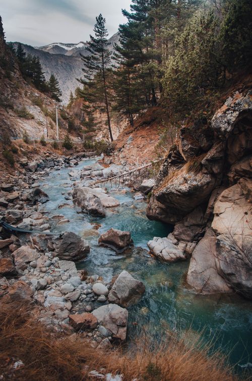 Free Peaceful mountain creek with rocks and trees in Kabardino-Balkaria, Russia, showcasing pristine nature. Stock Photo