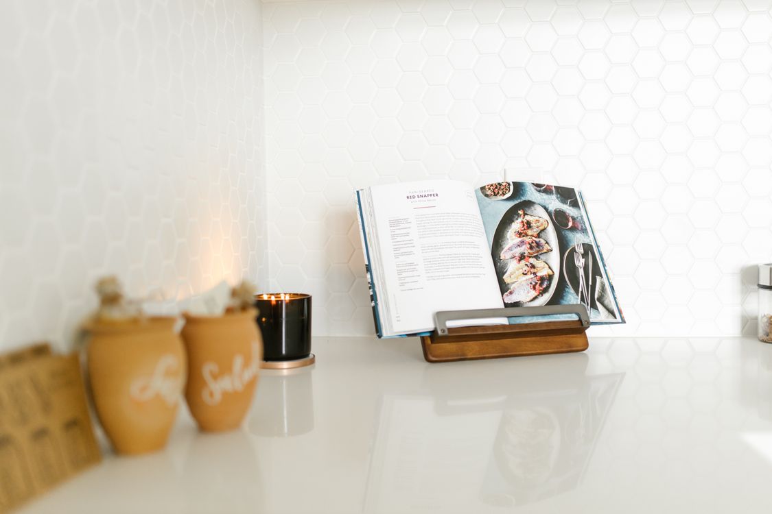 An Open Cookbook on a Kitchen Counter · Free Stock Photo