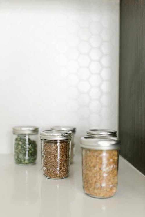 Free Clear Glass Jars With Brown Powder Inside Stock Photo
