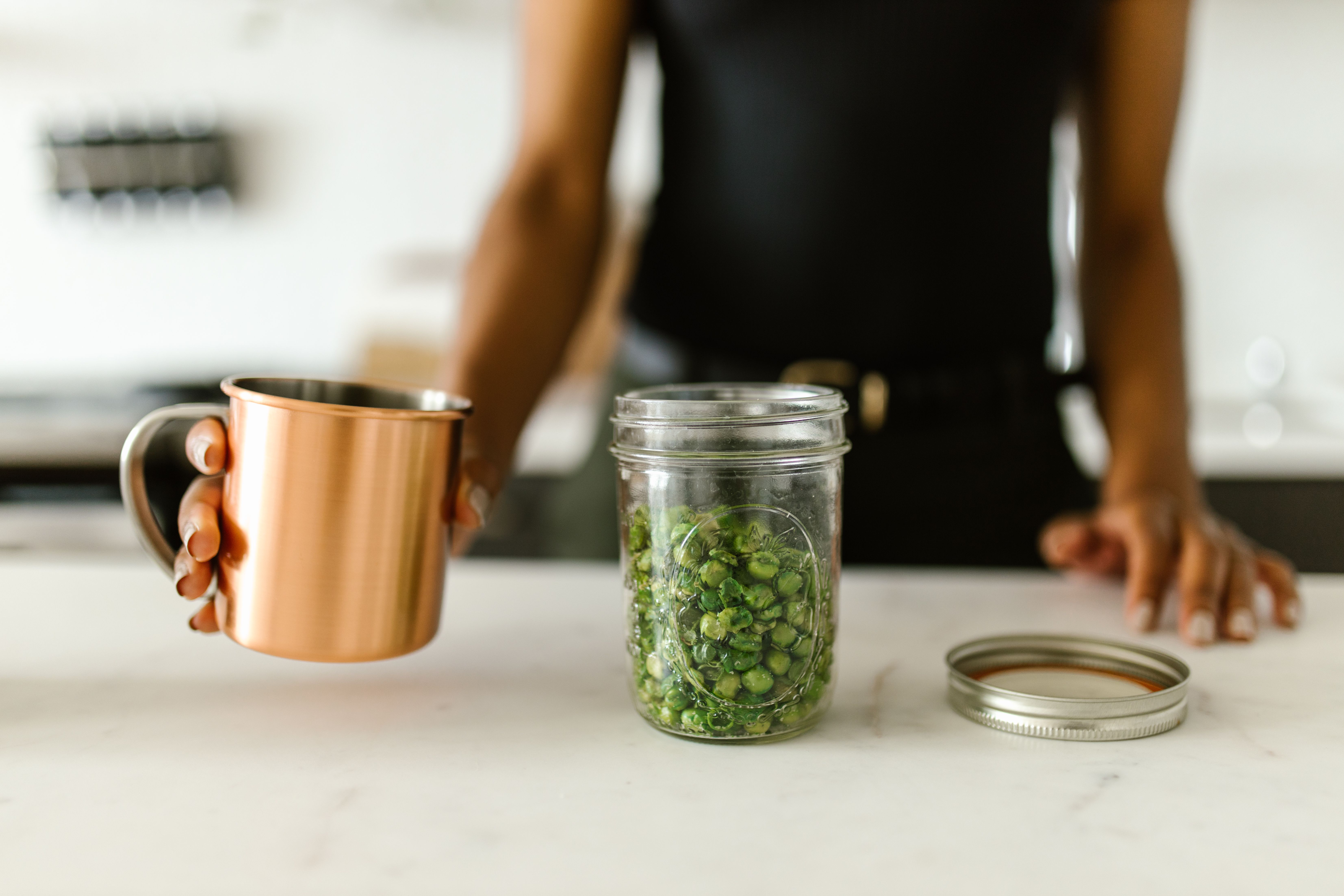 Fresh green beans and peas cooking in garlic butter