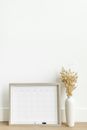 Organizing Calendar and Vase on a Table