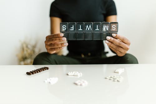 A Person Holding a Pillbox 