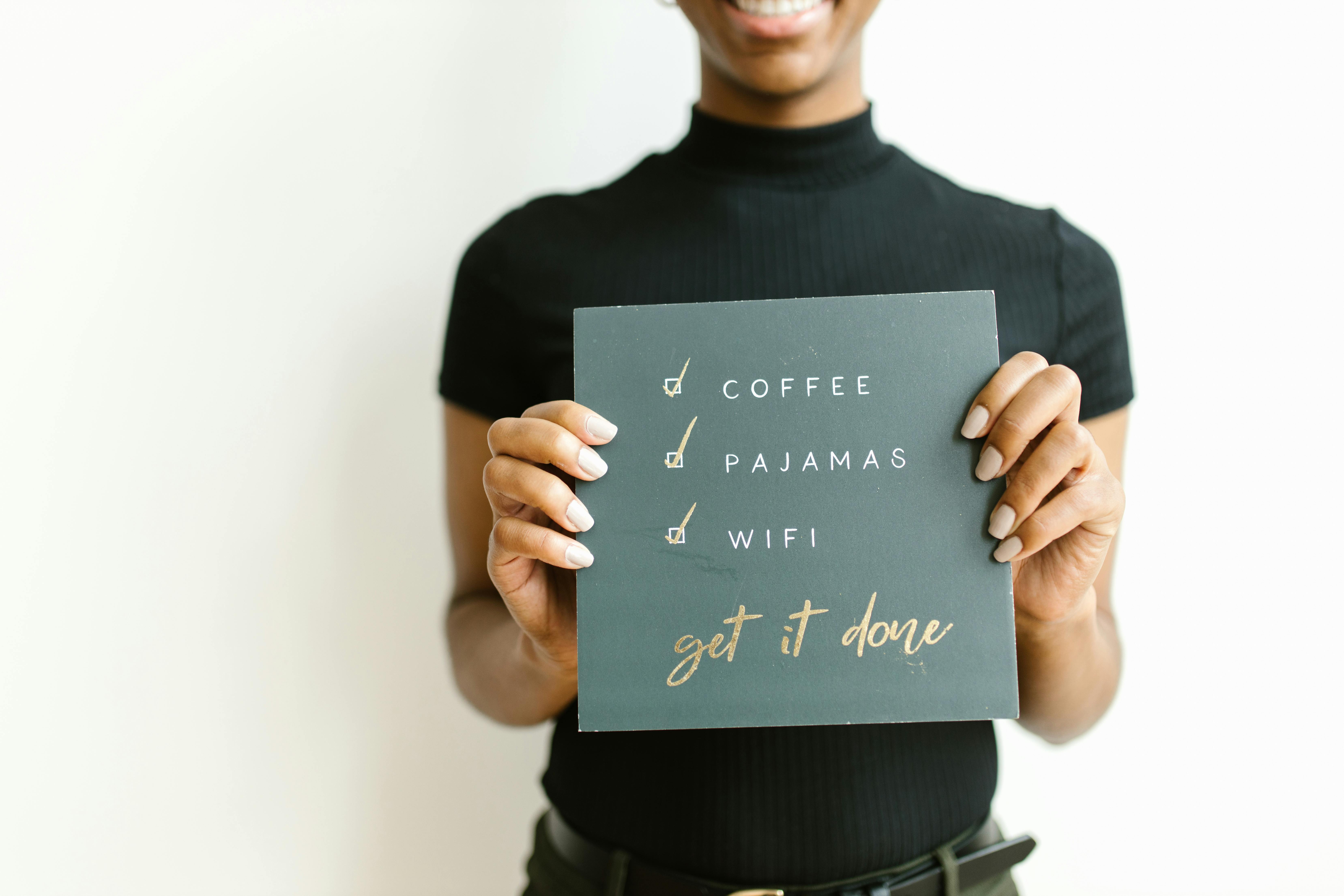 woman holding a to do list board