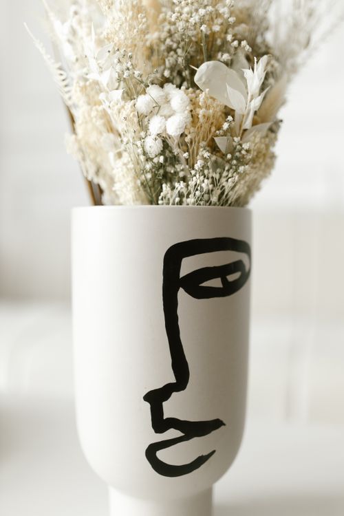 Free Elegant minimalist vase with artistic design and dried flowers. Stock Photo
