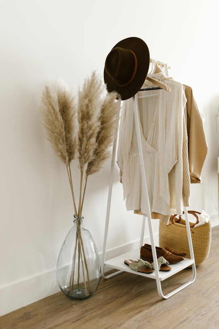 Garments And Clothes Hanging On A Clothing Rack 