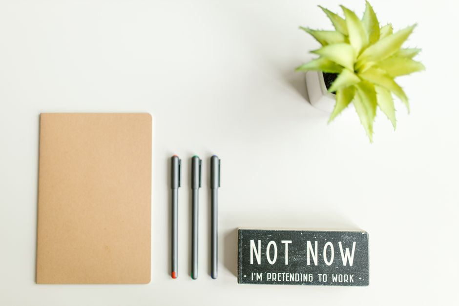 notebook and pen on desk real home lifestyle photo 1