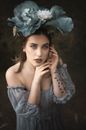 Woman in White and Blue Floral Dress