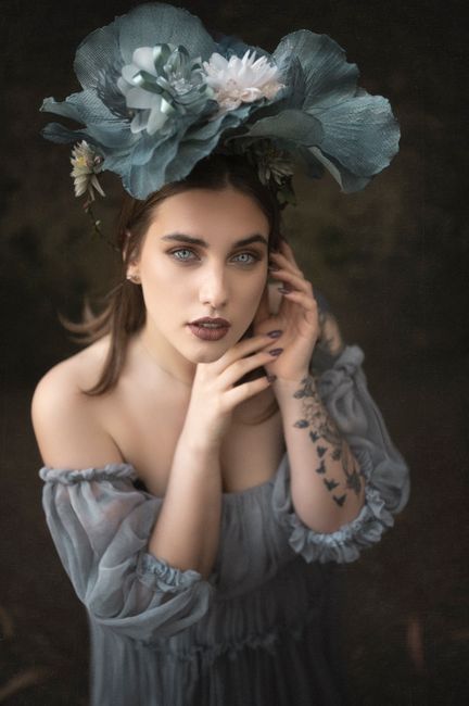 Captivating portrait of a woman in Portugal with floral headpiece, embodying elegance and style.