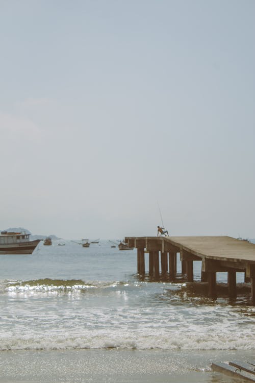 An Angler Fishing on the Dock